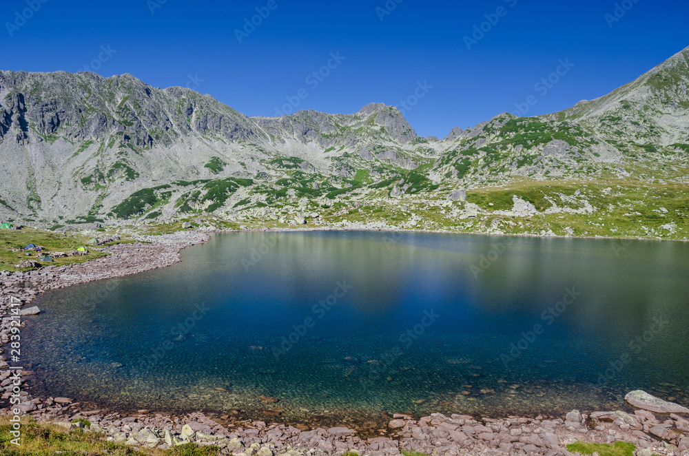 Mountain landscape and glacial lake in Retezat National Park, Carpathian Mountains, Romania
