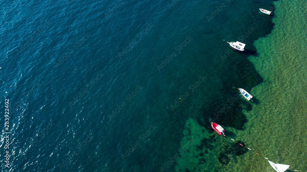 Top view of boat parking near sea coast. Aerial view a group of  boats at seaside of Turkey