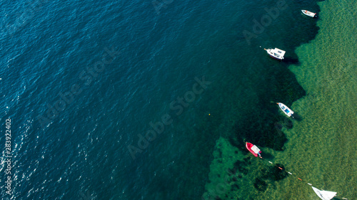 Top view of boat parking near sea coast. Aerial view a group of boats at seaside of Turkey