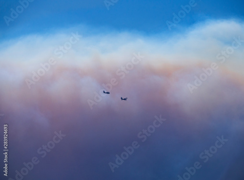 Fire planes on the background of smoke from fire and fire on the Greek island of Evia, Greece photo