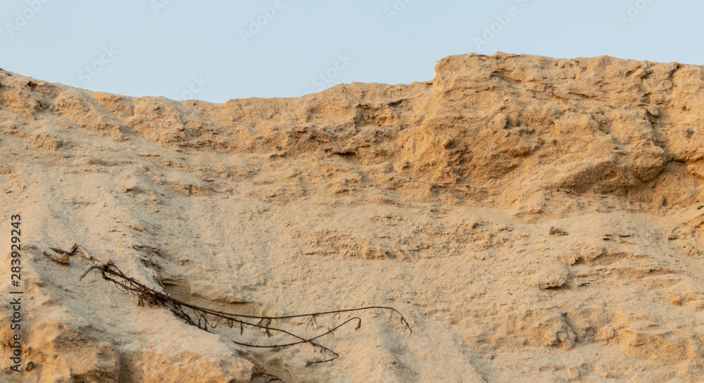Sand hill for construction work. Summer golden sand. Sand hill for construction work. Summer golden sand.