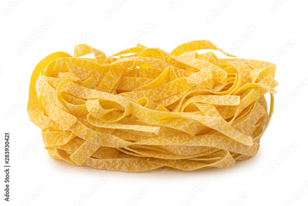 Rolled fettuccine shape of italian pasta on whte background isolated Rolled fettuccine shape of italian pasta on whte background isolated