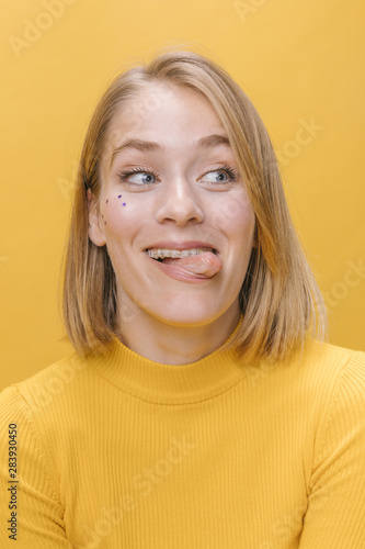 Portrait of woman with different facial expressions in a yellow scene