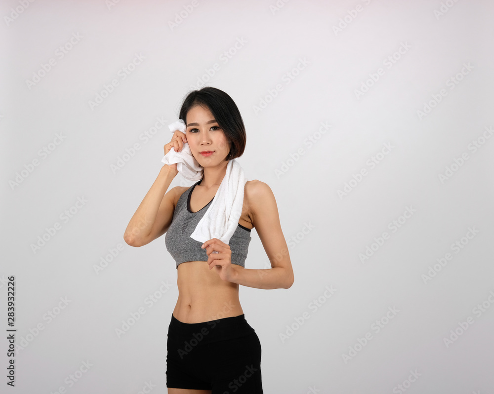 sporty fitness woman in sportswear with towel on white background. sporty fitness woman in sportswear with towel on white background.