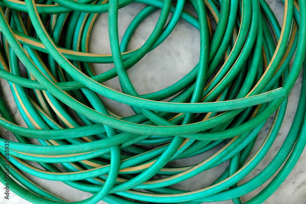 Closed-up Garden Hose on Marble Ground. Closed-up Garden Hose on Marble Ground.