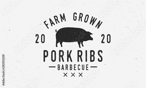 Pork Ribs vintage logo, label, badge. Pig silhouette. Vintage element for restaurant menu design. Retro logo template with grunge texture for barbecue, steak house, grill and bar.