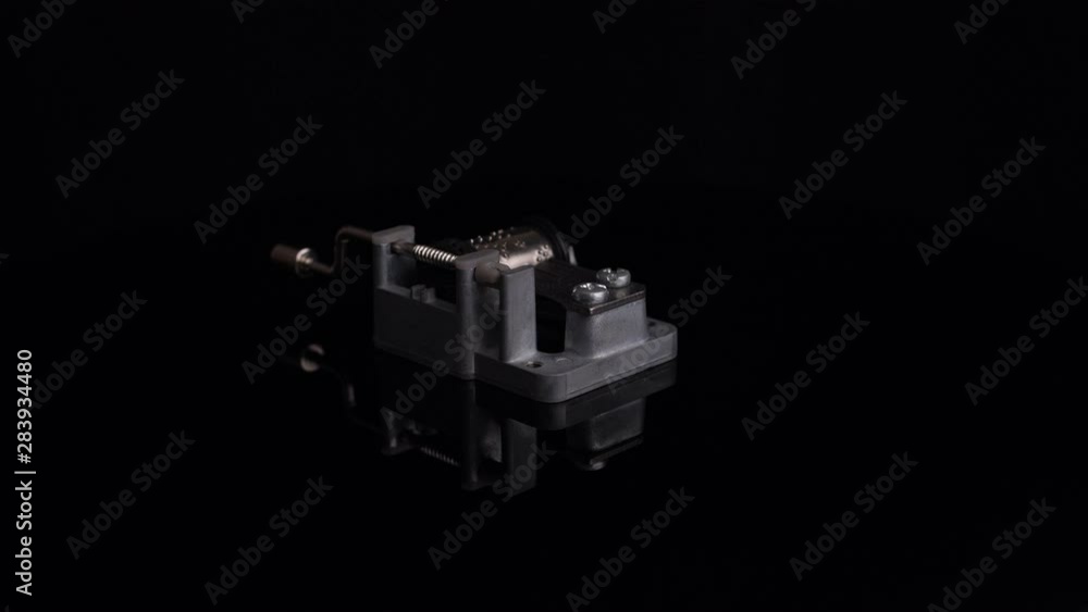 LOCKED OFF Isolated old music box spinning over a black background LOCKED OFF Isolated old music box spinning over a black background