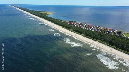 Beach in beautiful city Chalupy resort in Poland. Aerial video. Baltic Sea.Waves coming in. photo