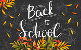 Welcome back to school. Black board with autumn leaves