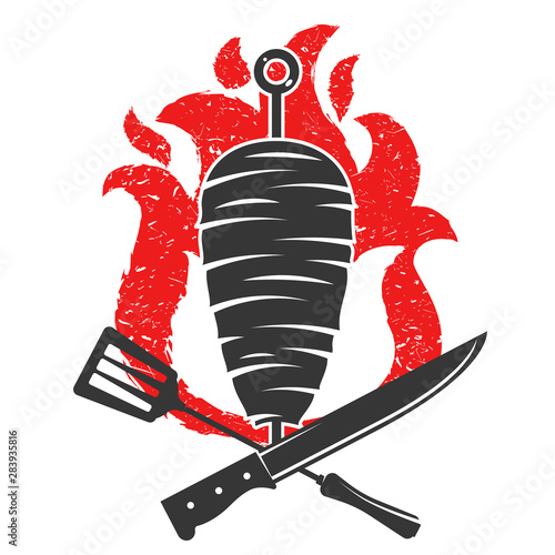 Kebab with knife and fork on the background of fire silhouette