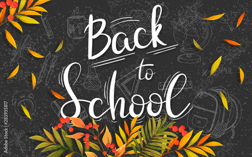 Welcome back to school. Black board with autumn leaves