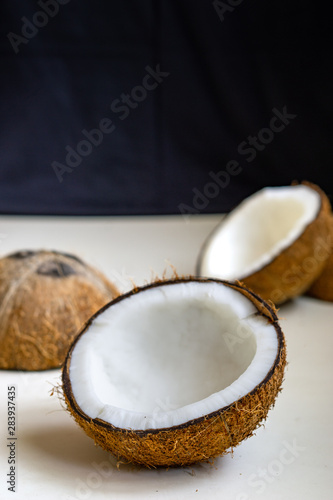 Raw fresh coconut on white background.