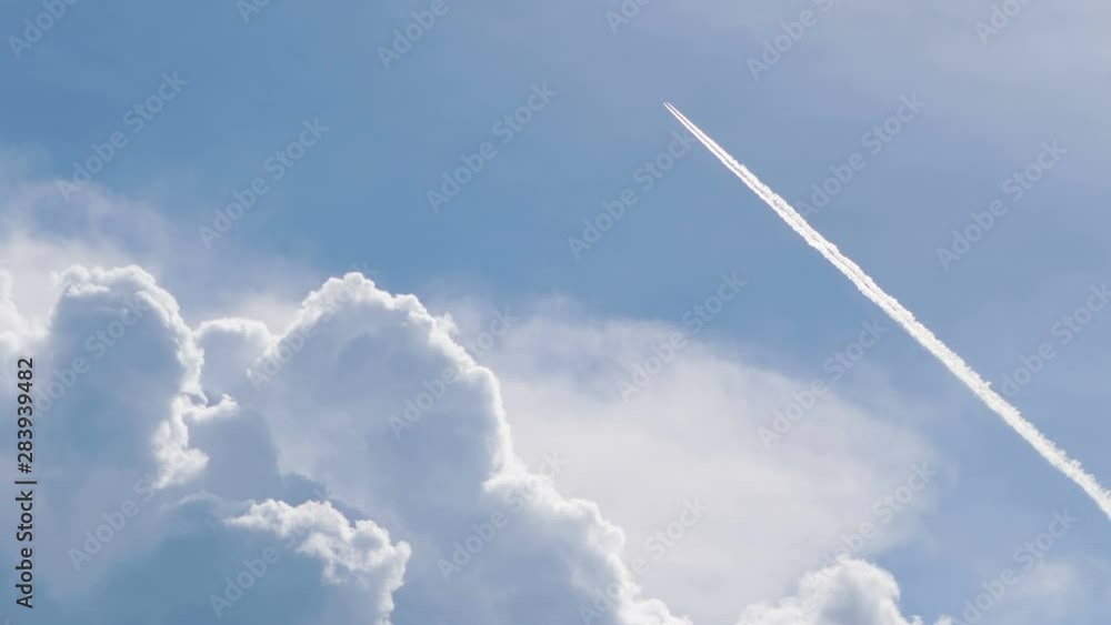 Airplane flying and passing the skyline in 4k Airplane flying and passing the skyline in 4k