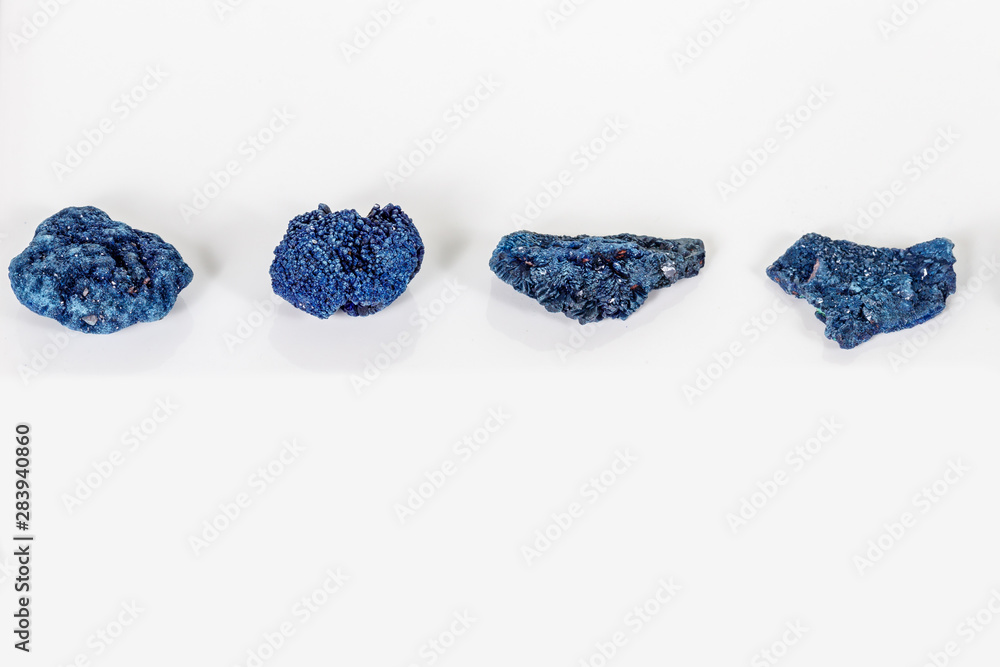 Macro mineral stone Malachite and Azurite against white background Macro mineral stone Malachite and Azurite against white background