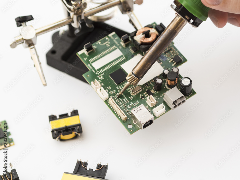 Using soldering iron to repair a circuit