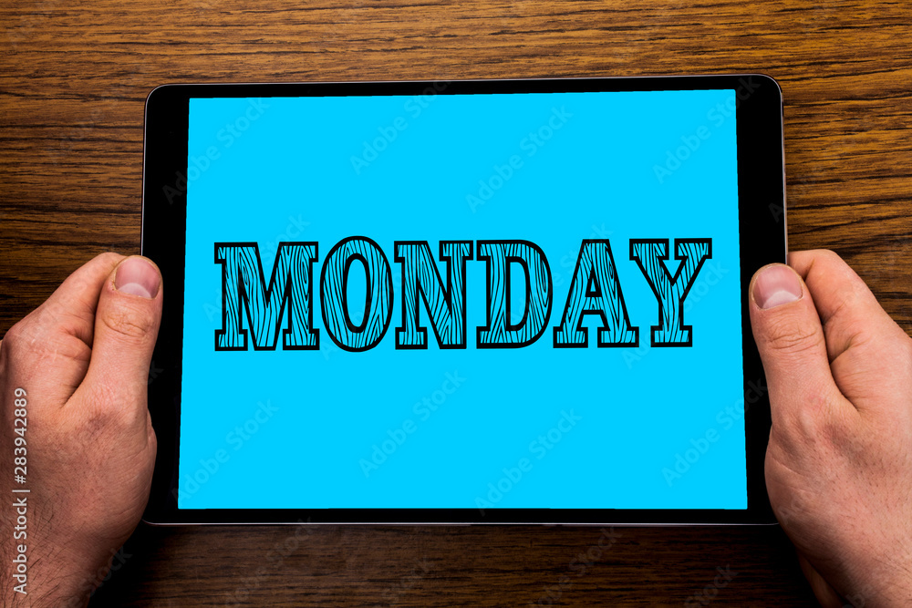 Text sign showing Monday. Conceptual photo First day of the week Back to work Weekend is over Wakeup Early written Tablet Screen holding in Hand wooden background. Text sign showing Monday. Conceptual photo First day of the week Back to work Weekend is over Wakeup Early written Tablet Screen holding in Hand wooden background.