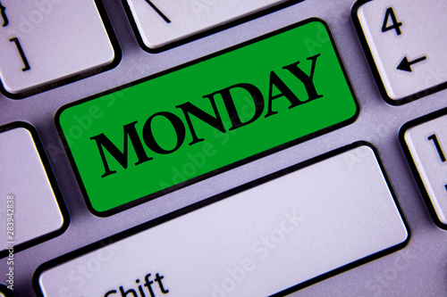 Word writing text Monday. Business concept for First day of the week Back to work Weekend is over Wakeup Early written Green Key Button White Keyboard with copy space. Top view. photo