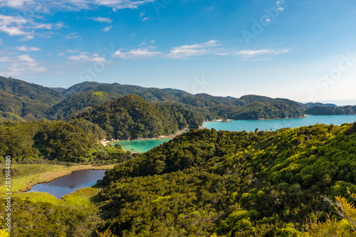 Looking across the beautiful and stunning Marlborough Sound and the surrounding hills at the top of the South Island, New Zealand on a sunny day