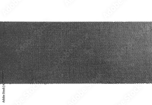 Wide piece of black matte cloth gaffer tape isolated on white background. photo