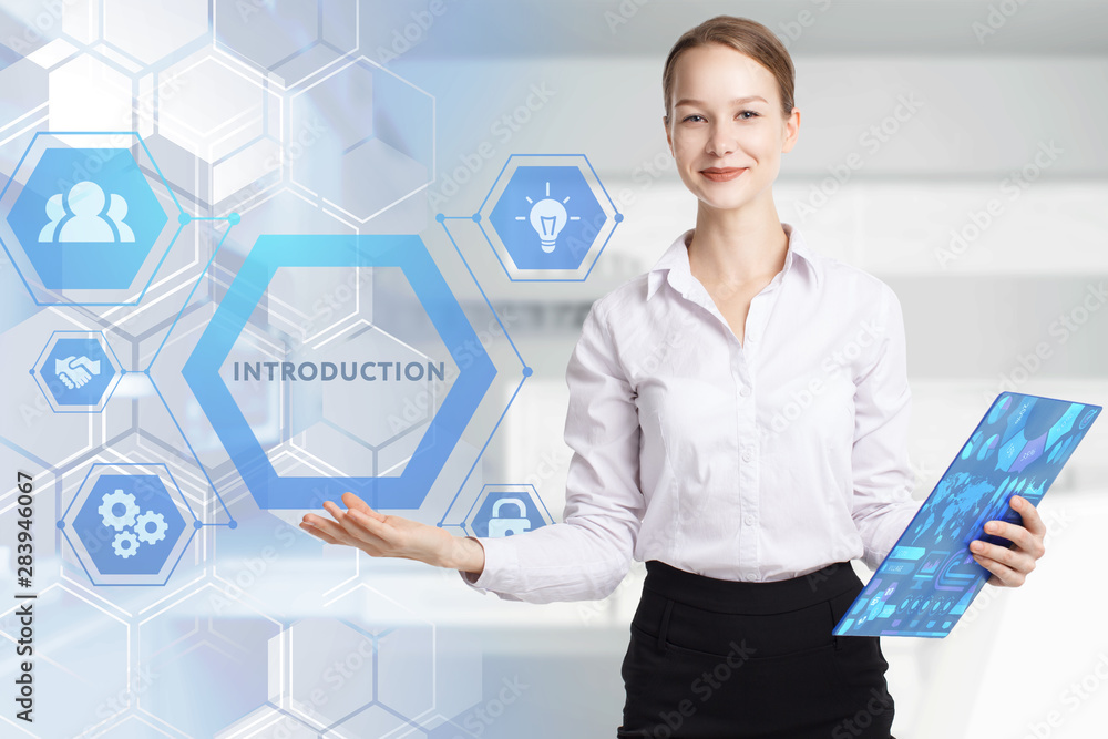 The concept of business, technology, the Internet and the network. A young entrepreneur working on a virtual screen of the future and sees the inscription: Introduction The concept of business, technology, the Internet and the network. A young entrepreneur working on a virtual screen of the future and sees the inscription: Introduction
