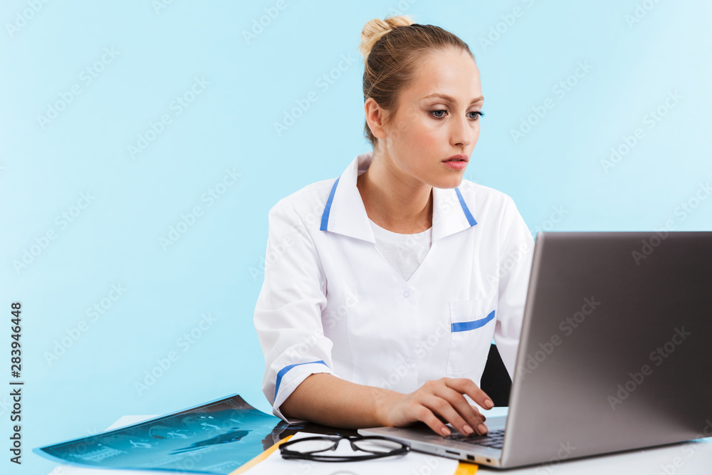 Beautiful young woman doctor wearing uniform Beautiful young woman doctor wearing uniform