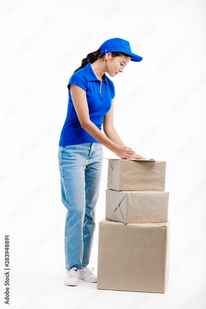 Post office worker ships parcels to the clients. Post office worker ships parcels to the clients.