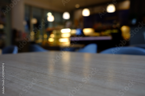 Close up Surface of Wooden Table in Cafe with Bokeh Background. (Selective Focus)