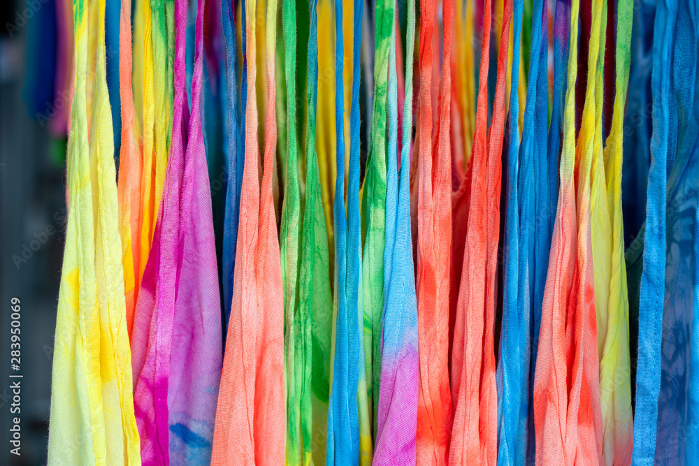 Summer clothes on hangers for sale in local street market in Thailand, close up Summer clothes on hangers for sale in local street market in Thailand, close up
