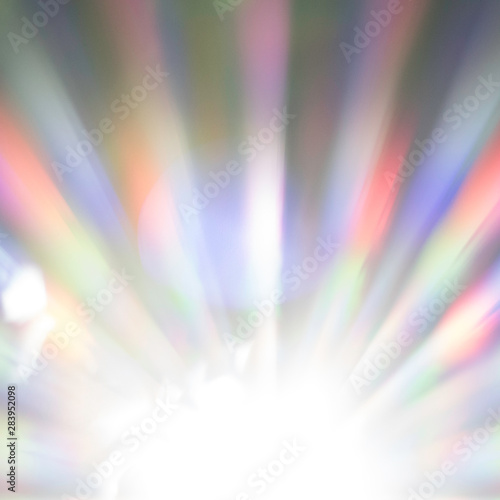 Sunny background of the sunlight which is sparkling in the rainbow colors. These seven colors are red, orange, yellow, green, blue, indigo and violet. Copy space in the shining sun.