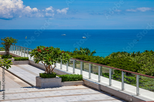 Sea View Hotel with Green Foliage and Blue Sky