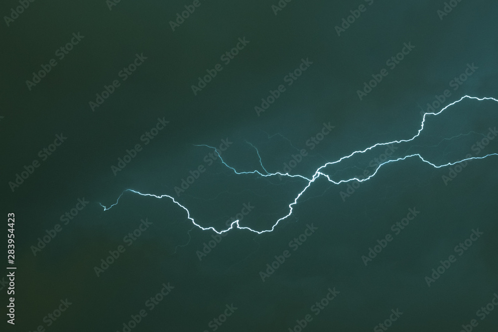 Lightning between the clouds on a summer evening Lightning between the clouds on a summer evening