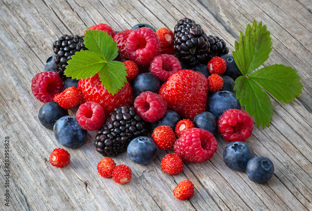Ripe berries on a wooden board Ripe berries on a wooden board