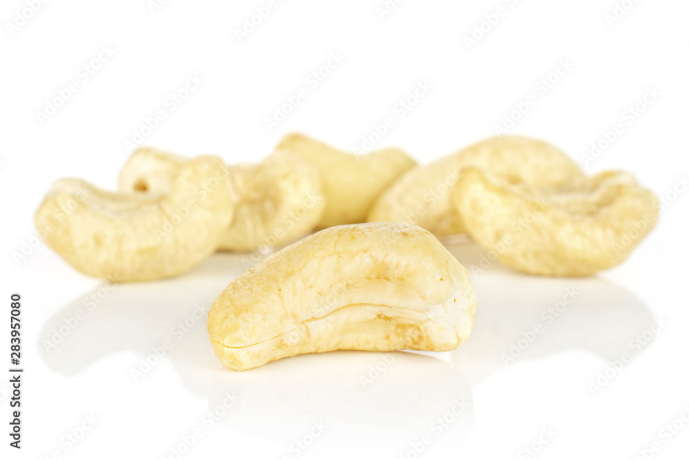 Group of six whole unsalted beige cashew isolated on white background Group of six whole unsalted beige cashew isolated on white background