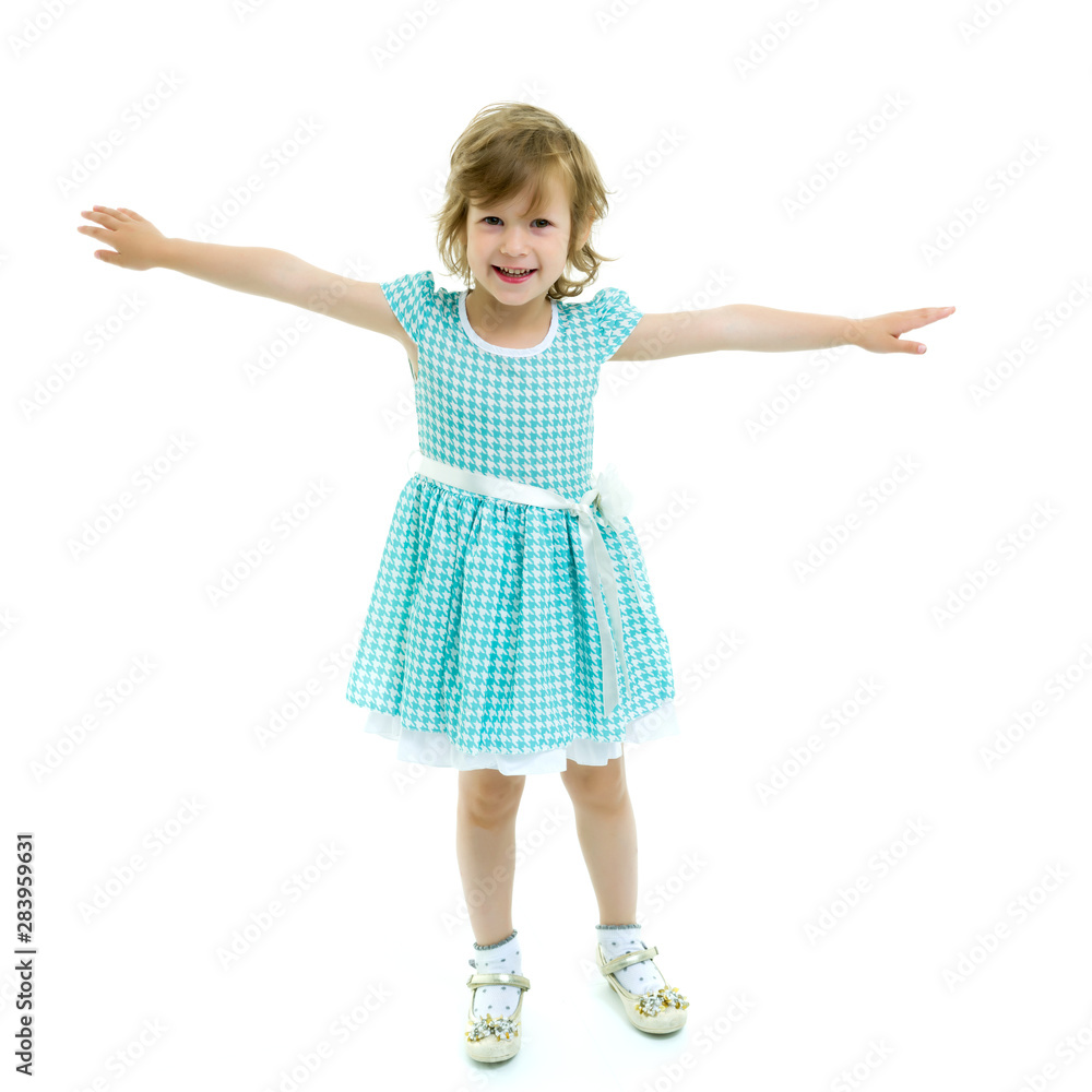 A cheerful little girl is dancing. A cheerful little girl is dancing.
