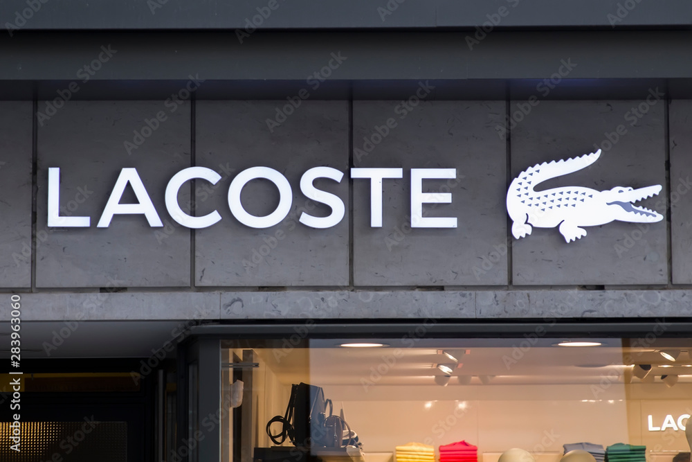 Detail of Lacoste store in Basel, Switzerland. It is a French fashion  company, founded in 1933. – Stock-Foto | Adobe Stock