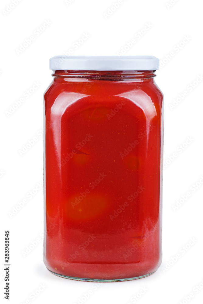 Glass jar with tomato juice isolated on white background Glass jar with tomato juice isolated on white background
