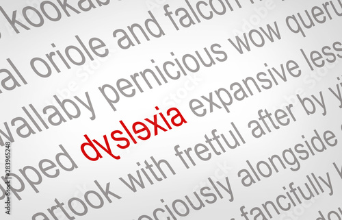 Close up of the word dyslexia printed on a piece of white paper, spelled incorrectly