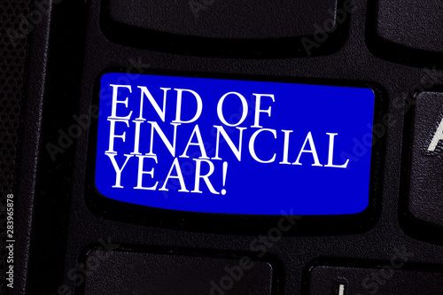 Writing note showing End Of Financial Year. Business photo showcasing Taxes time accounting June database cost Sheets Keyboard key Intention to create computer message pressing keypad idea