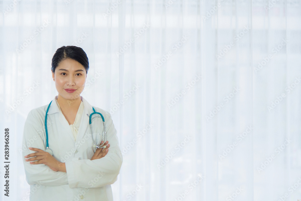 Asian female doctor, smiling in the morning, confident female doctor, ready to work in medical health care, window background, white curtain Asian female doctor, smiling in the morning, confident female doctor, ready to work in medical health care, window background, white curtain