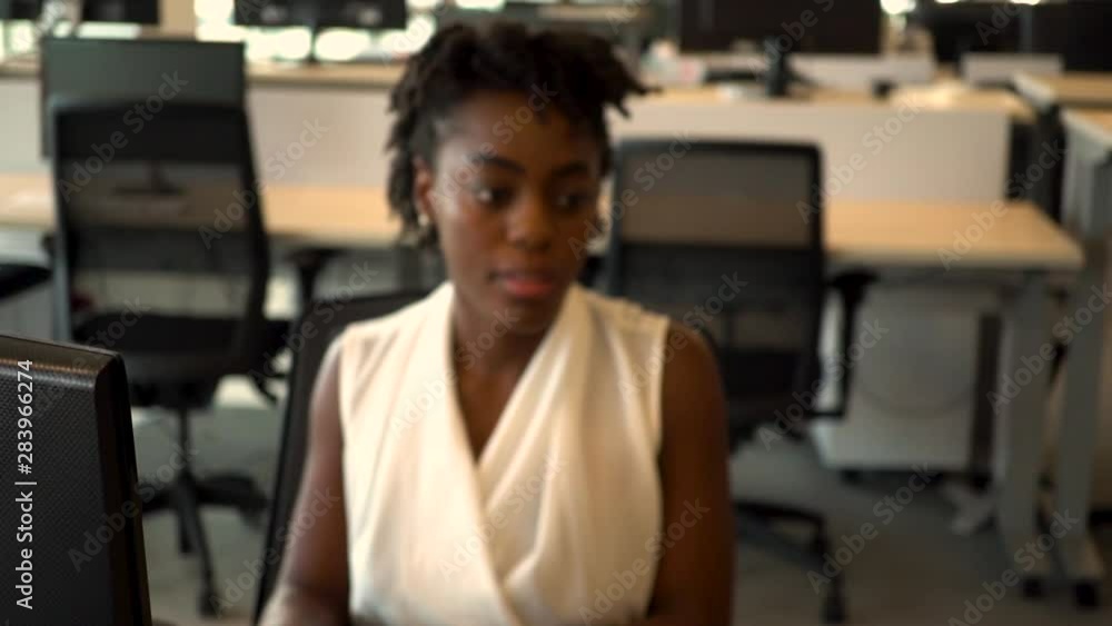 Young African American Businesswoman working in a diverse business office Young African American Businesswoman working in a diverse business office