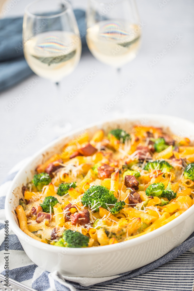 Baked pasta penne with broccoli smoked pork neck mozzarela cheese and othe ingredients