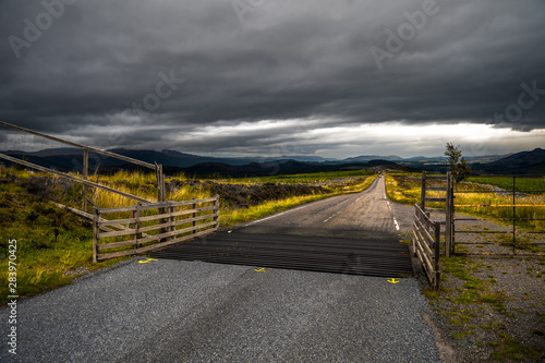 Narrow Road Through Rural Highland Landscape Near Loch Ness In Scotland