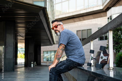 Skater with a tattoo resting