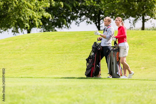 Golfing couple at golf field