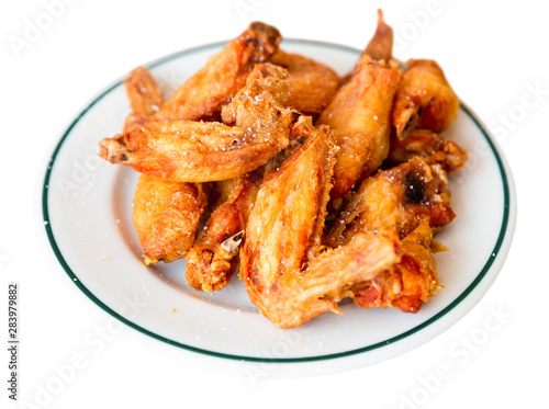 Picture of dish of tasty fried chicken wings served at plate