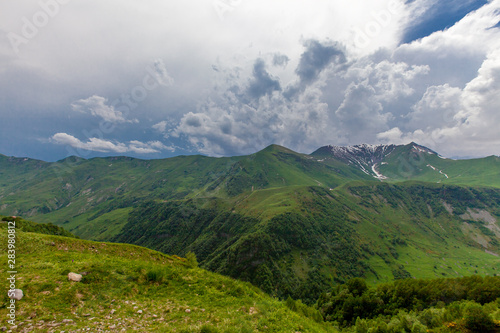 Mountains rocks landscape with cloudy dramatic sky photo