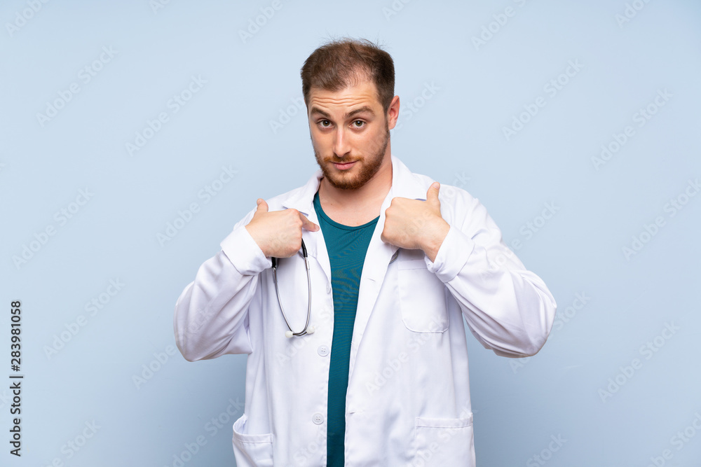 Handsome doctor man over blue wall with surprise facial expression Handsome doctor man over blue wall with surprise facial expression