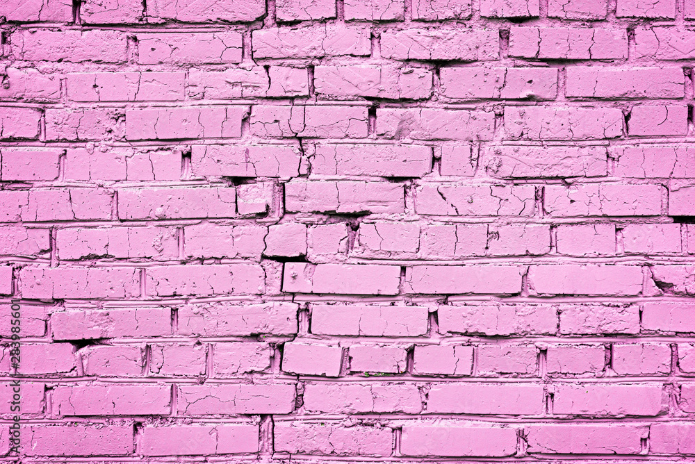 Close-up of a brick cracked wall of bright trendy pink color. Close-up of a brick cracked wall of bright trendy pink color.