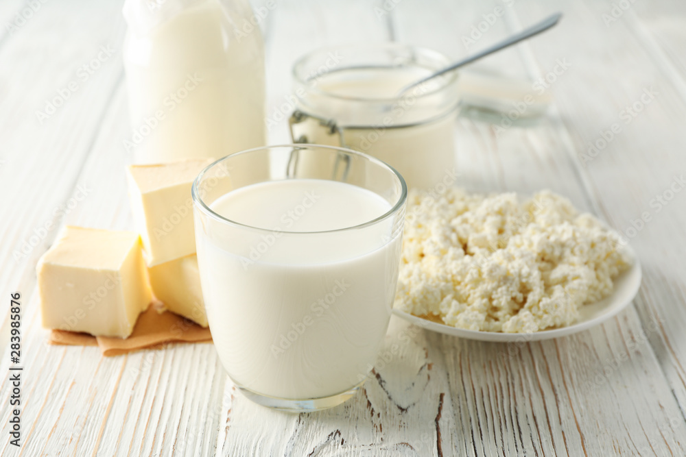 Different dairy products on white wooden background, space for text Different dairy products on white wooden background, space for text