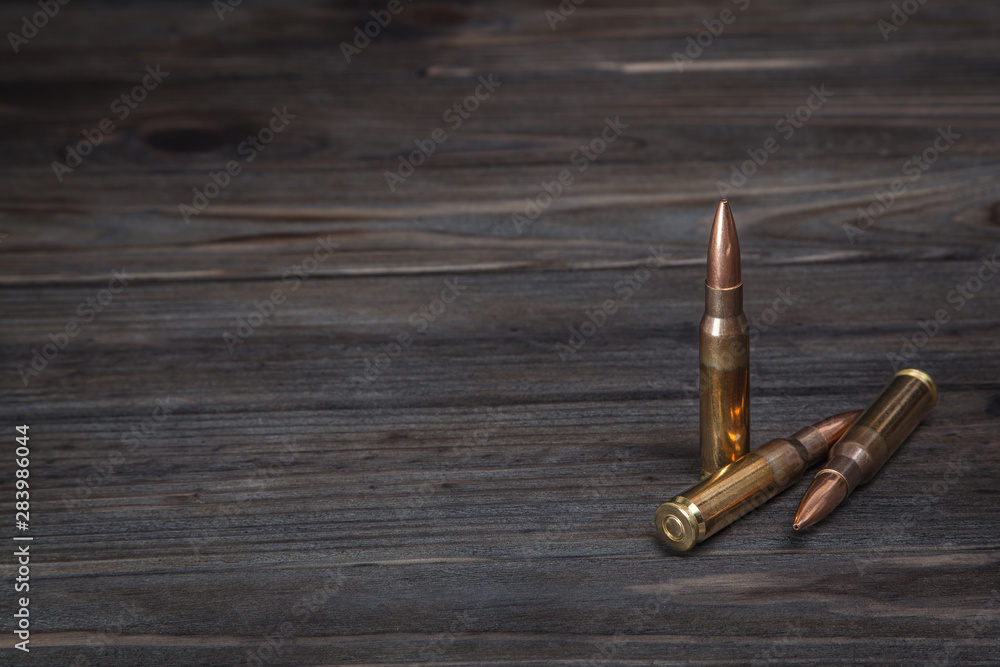 Cartridges on a dark wooden background Cartridges on a dark wooden background